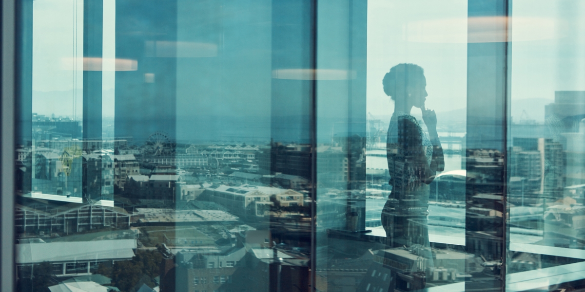 Woman looks out window